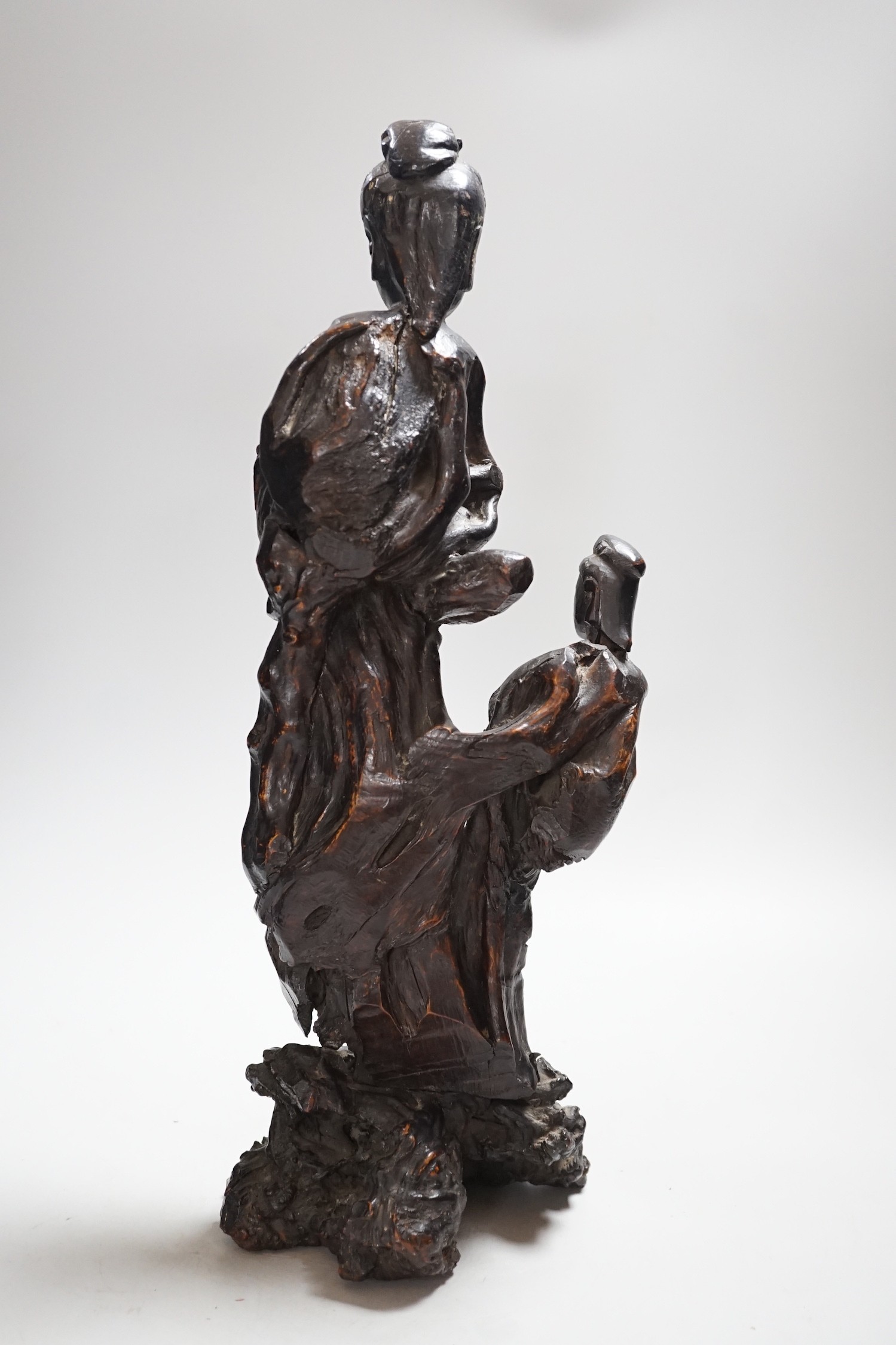 A Chinese root wood carving of two women, 42cm